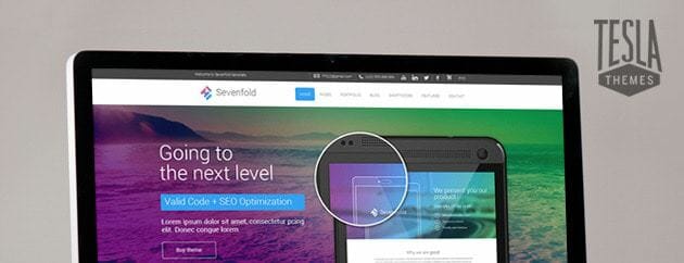 A laptop is displaying a website with a colorful design.