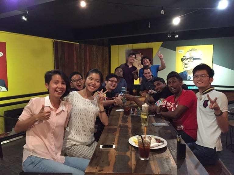 A group of people posing for a picture at a restaurant.
